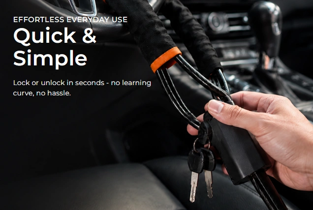 Hand unlocking the CarProtect Steering Wheel Lock with its key inside a car
